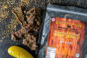 One of our exciting flavors of Dill Pickle Brisket Beef Jerky smothered in seasonings.