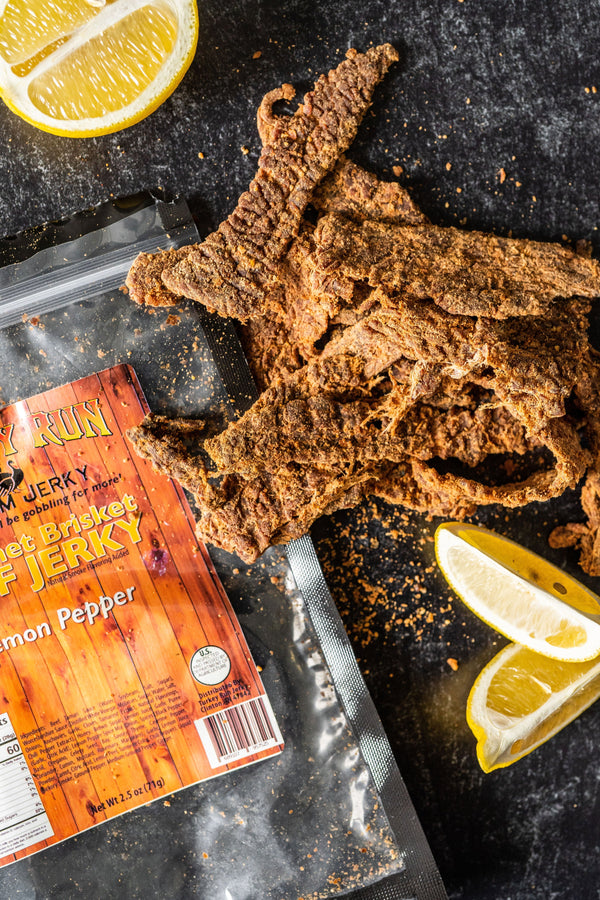 A photo of our delicous Lemon Peppered Brisket Beef Jerky smothered in seasonings