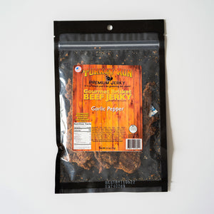 The front side of packaging for Garlic Pepper Beef Jerky